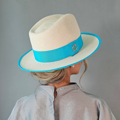 ISA classic Panama hat - sophisticated side profile showcasing handwoven Montecristi craftsmanship and aqua ribbon detail
