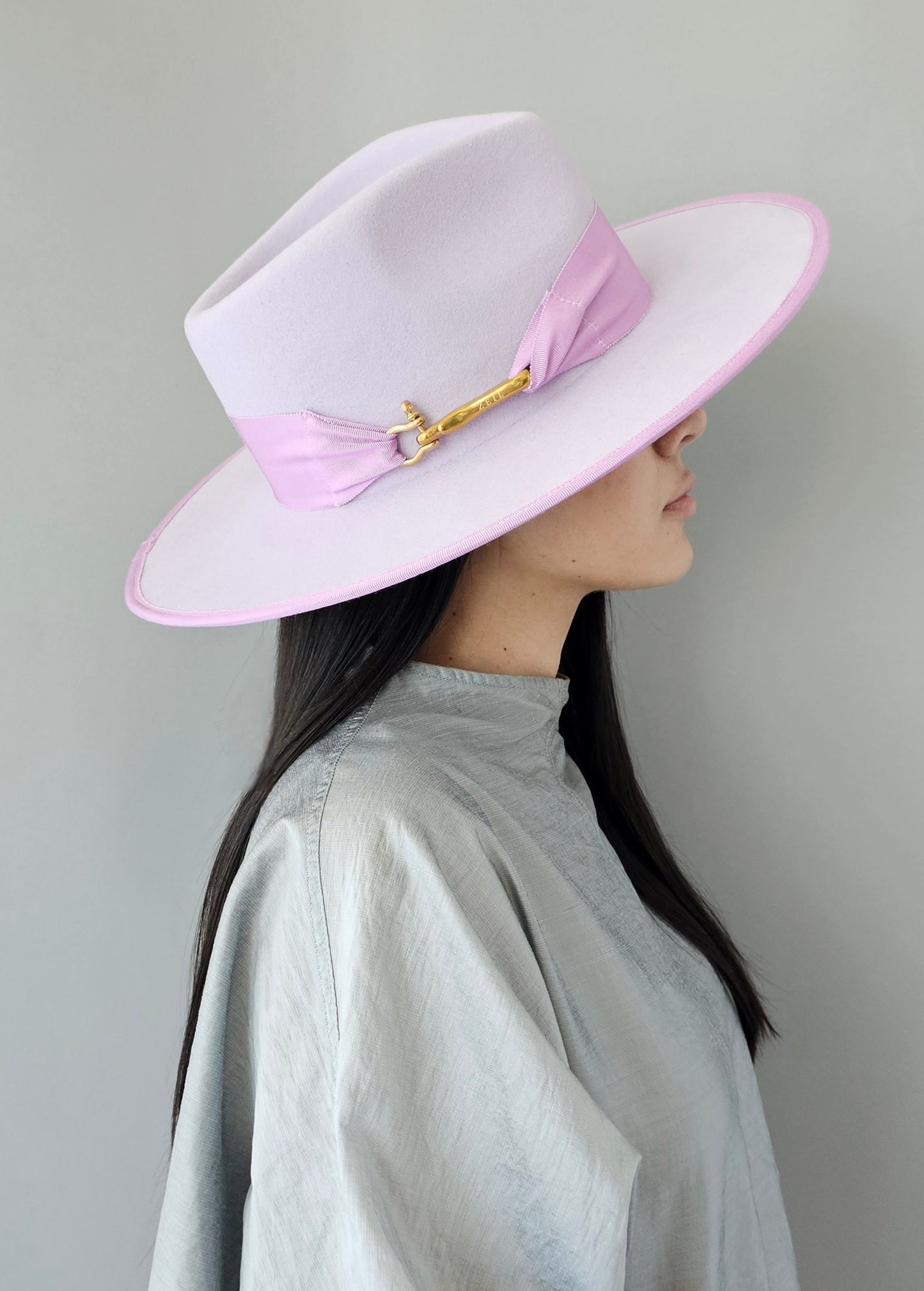 Side profile showing the elegant silhouette of Lavender wool hat
