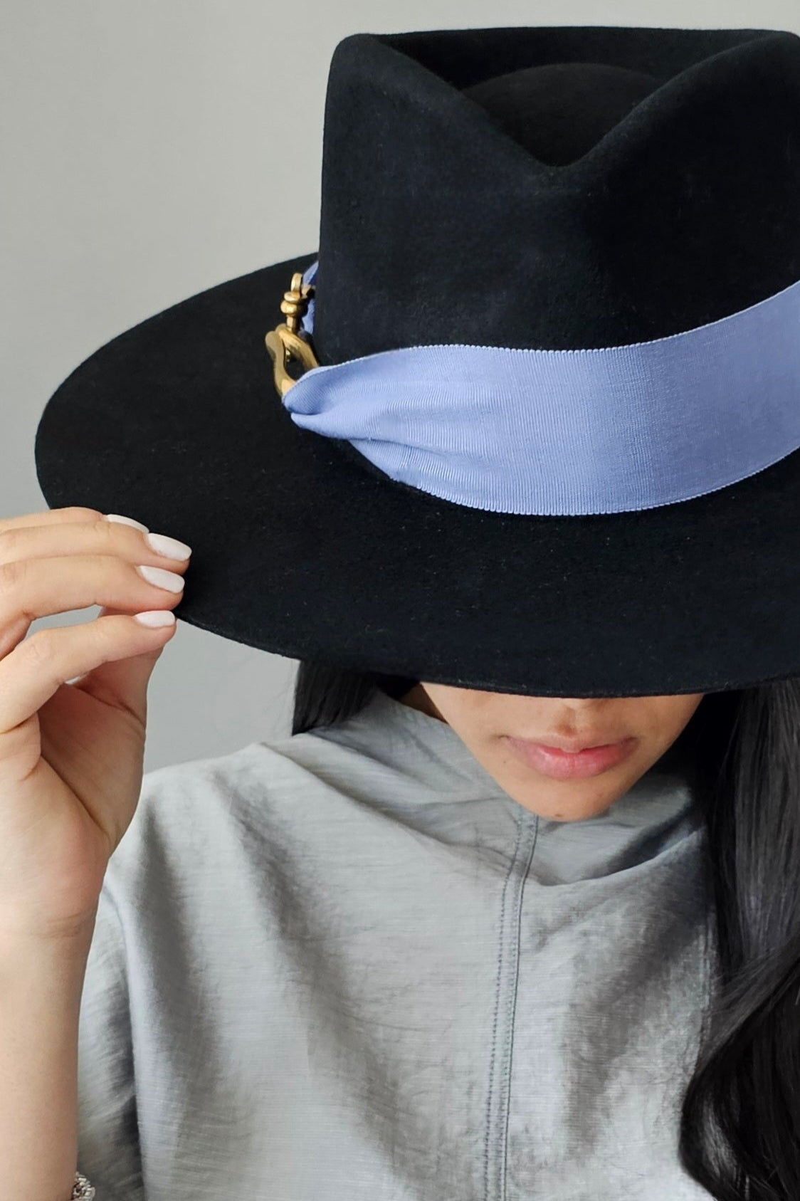 Close-up detail of black & periwinkle wool fedora showing luxurious material and Miami-designed craftsmanship