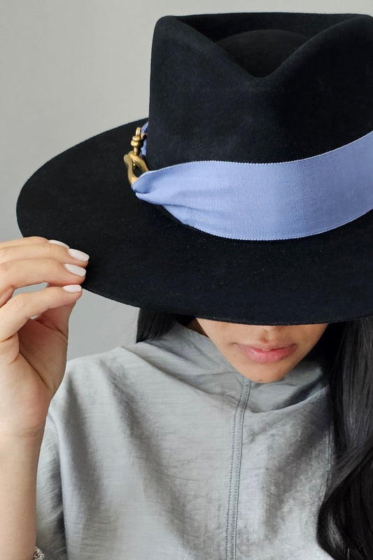 Close-up detail of black & periwinkle wool fedora showing luxurious material and Miami-designed craftsmanship