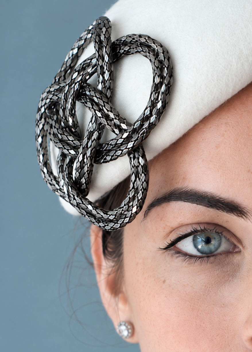 A close-up of Fleur Percher hat embellishment 