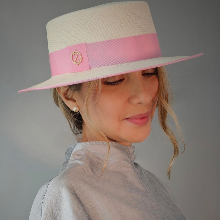 PAULINA Cordobes Panama hat - elegant styling showcase with luxury millinery branding and powder pink ribbon detail
