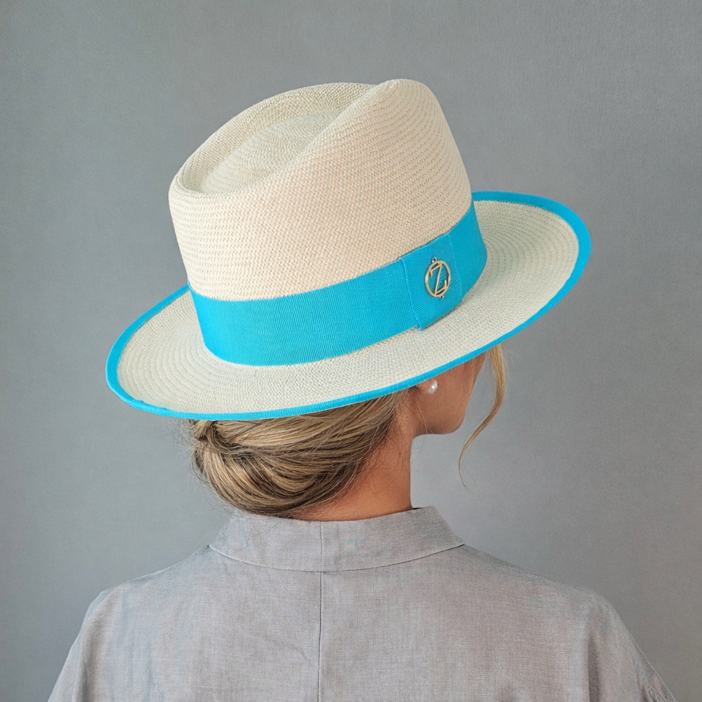 ISA classic Panama hat - sophisticated side profile showcasing handwoven Montecristi craftsmanship and aqua ribbon detail