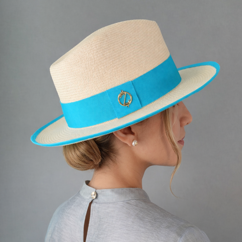 ISA classic Panama hat - sophisticated side profile showcasing handwoven Montecristi craftsmanship and aqua ribbon detail